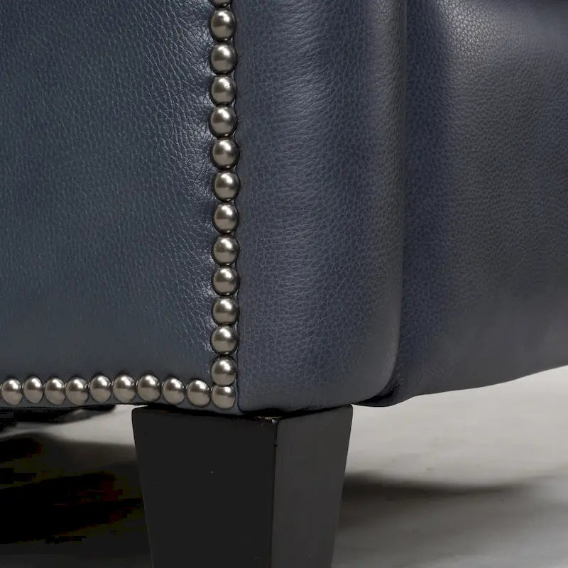 Fauteuil inclinable électrique double avec garniture cloutée en cuir véritable et port USB, idéal pour le home cinéma.
